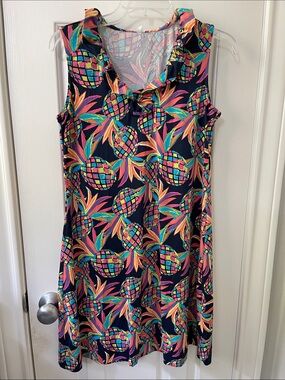 Sleeveless summer shift dress with pineapple design and ruffle around neckline